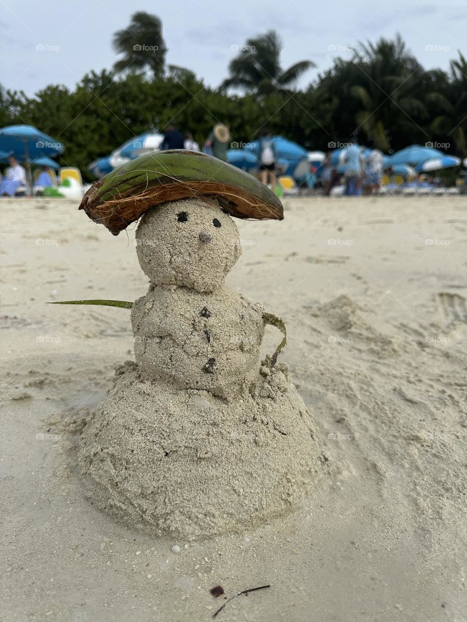 Sandy snowman at the beach