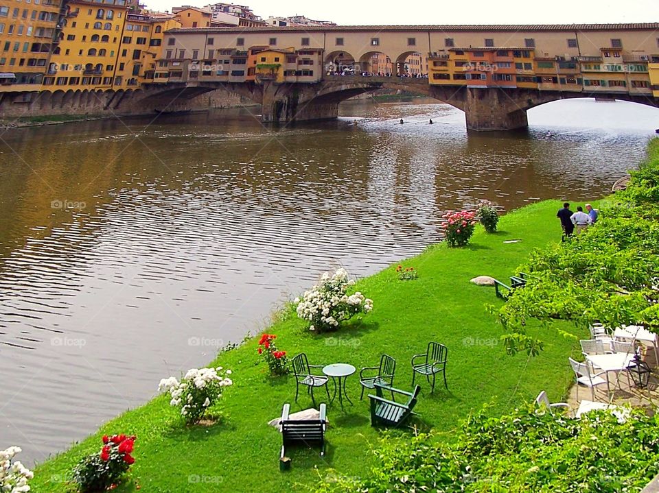 Florence, Italy: Summer Garden on banks of Arno with Ponte Vecchio in background