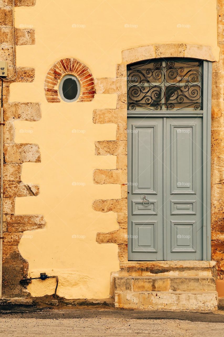 Front door on a yellow building 