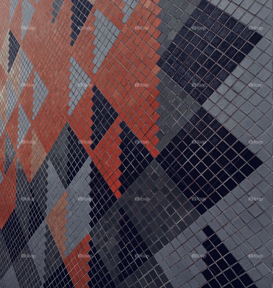 Close up of a wall in a mosaic with geometrical shapes
