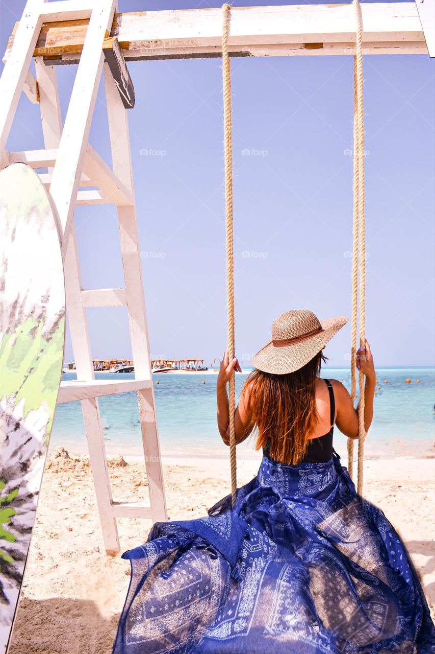 “Swinging at the beach “