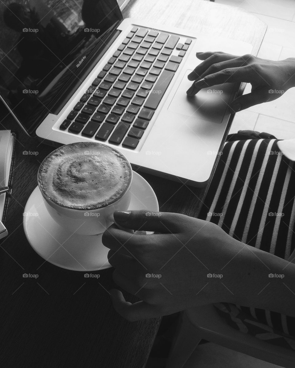 Coffee on one hand and typing on the other