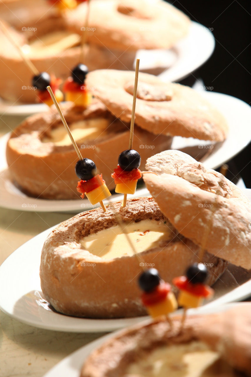 Clam chowder served on bread bowl, lineup