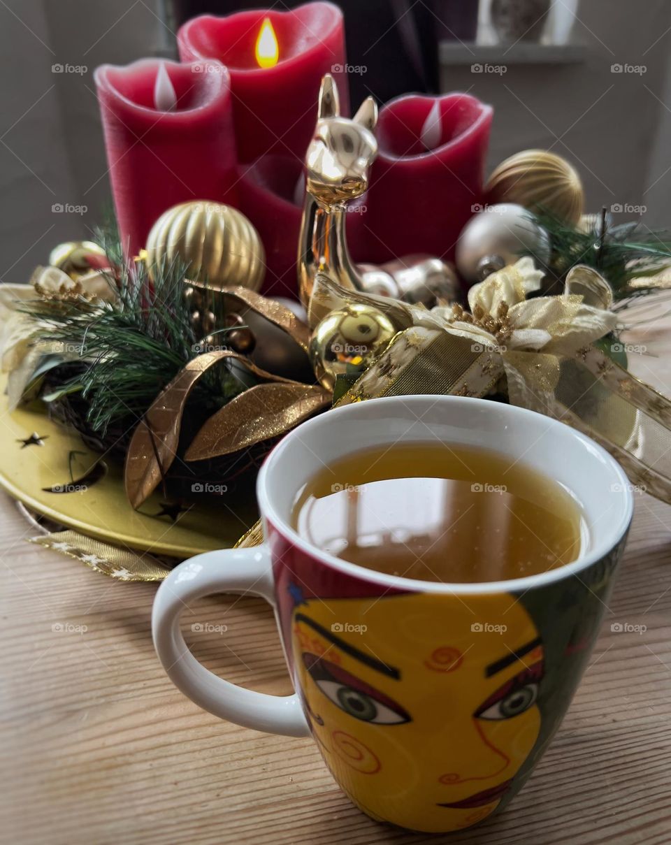 Winter tea with Advent wreath and the first candle lighted up.