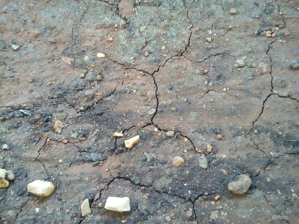 Cracked Soil with Stones Texture