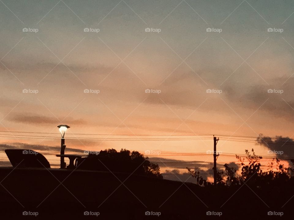 Good Early Morning Can You Here the Crack Of Dawn. Beautiful Green Hues Some Yellows, Oranges,Pinks turning to Dark Hues just making Sunrise More Special. 