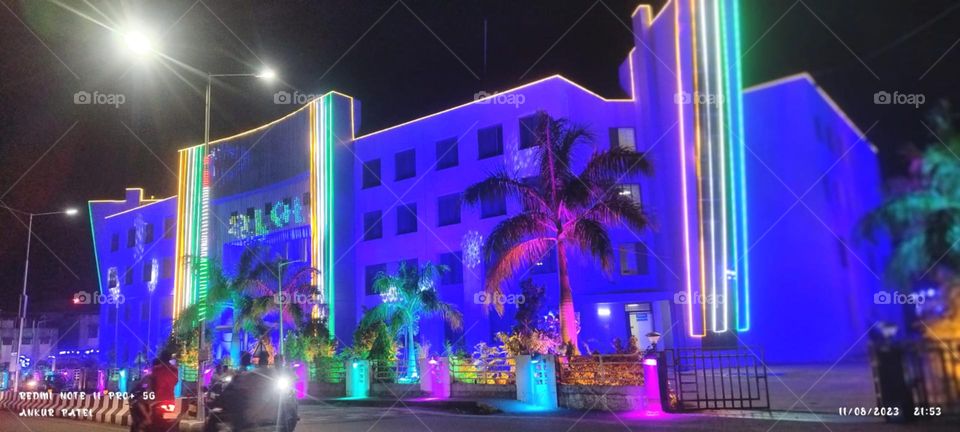 decorat the building for light and nice highlight reflection effect on building look so beautiful also tree and road look so nice