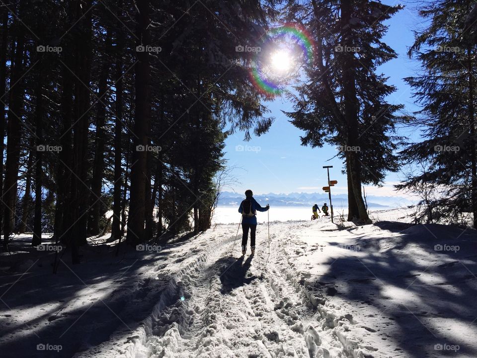 Sport activities at Winter time on a sunny day in Switzerland 