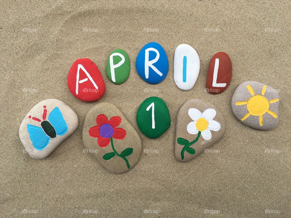 1 April with stones design over the sand 