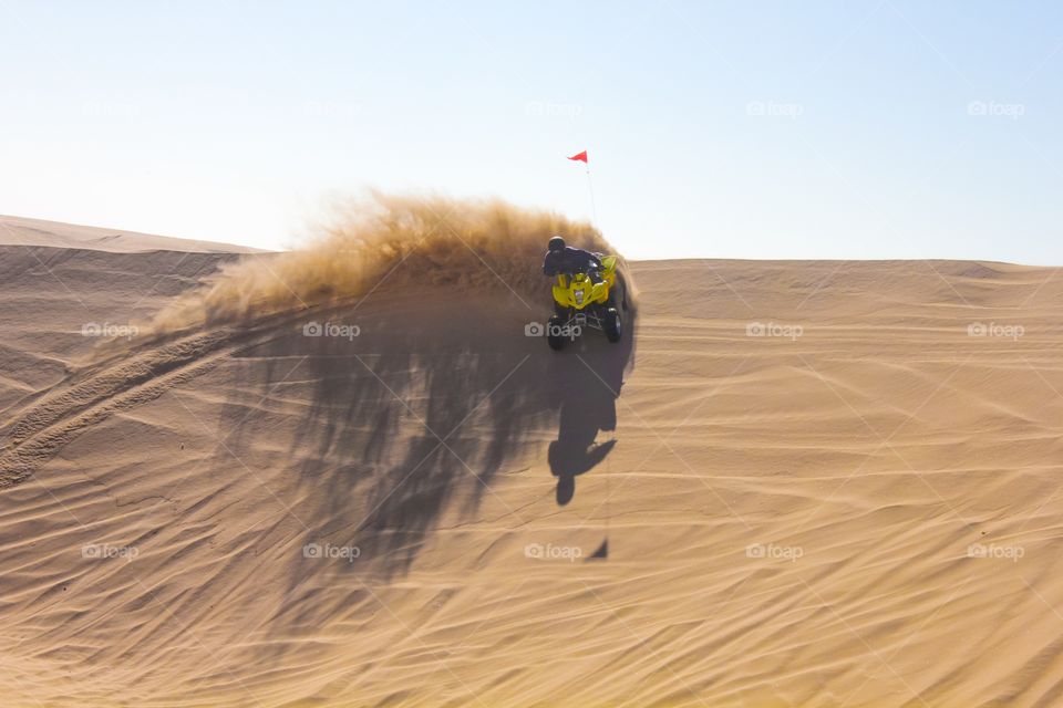 Man doing  quad bike riding in desert