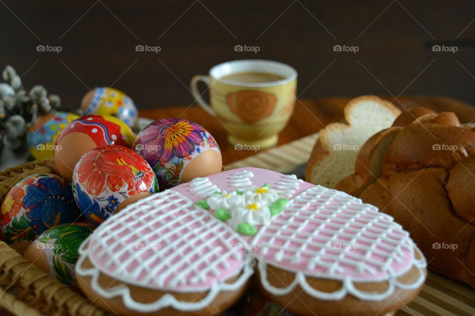 coffee cup with sweets buns and eggs Easter natural background, spring holiday