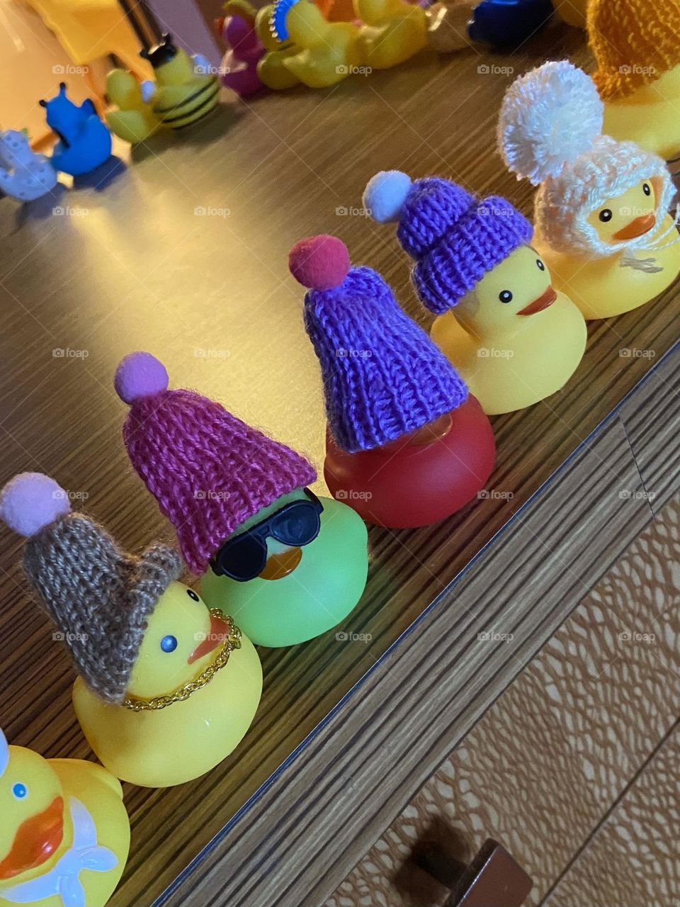 The importance of having all of your ducks in a row. Toy ducks with special knitted hats found on a cruise ship.