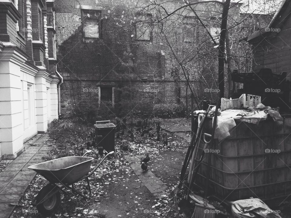 Constructing outdoor place with trolley, blocks and other stuff for constructing