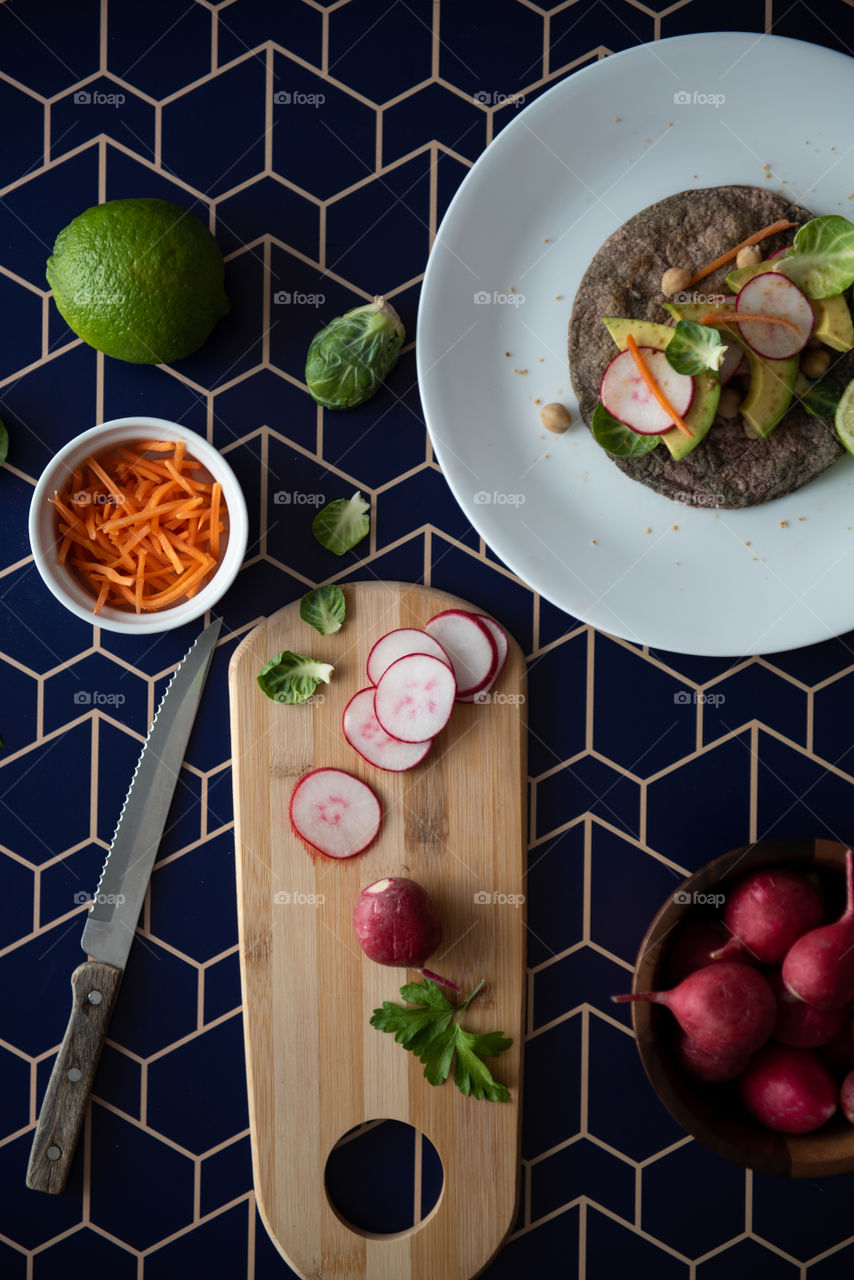 Flat lay of a veggie taco and ingredients 