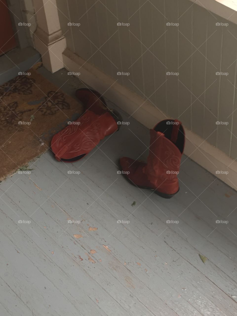 Red boots on porch