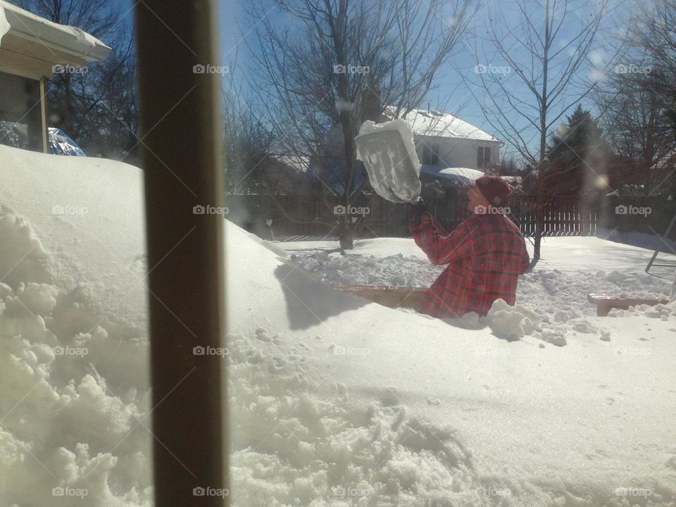 Shoveling a passage way off the deck