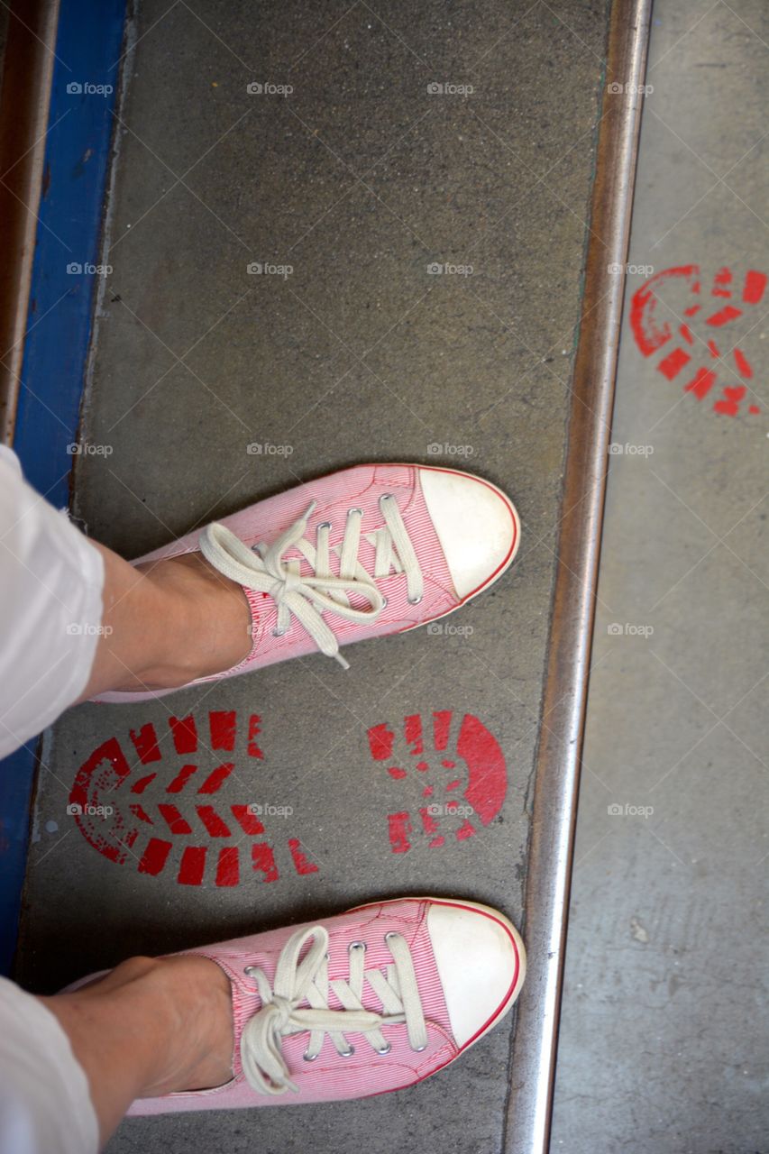Painted footsteps on stairs with feet going a different way