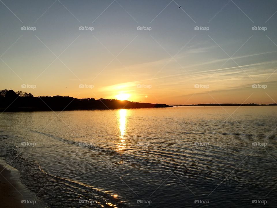 Reflection of sunlight in sea during sunset