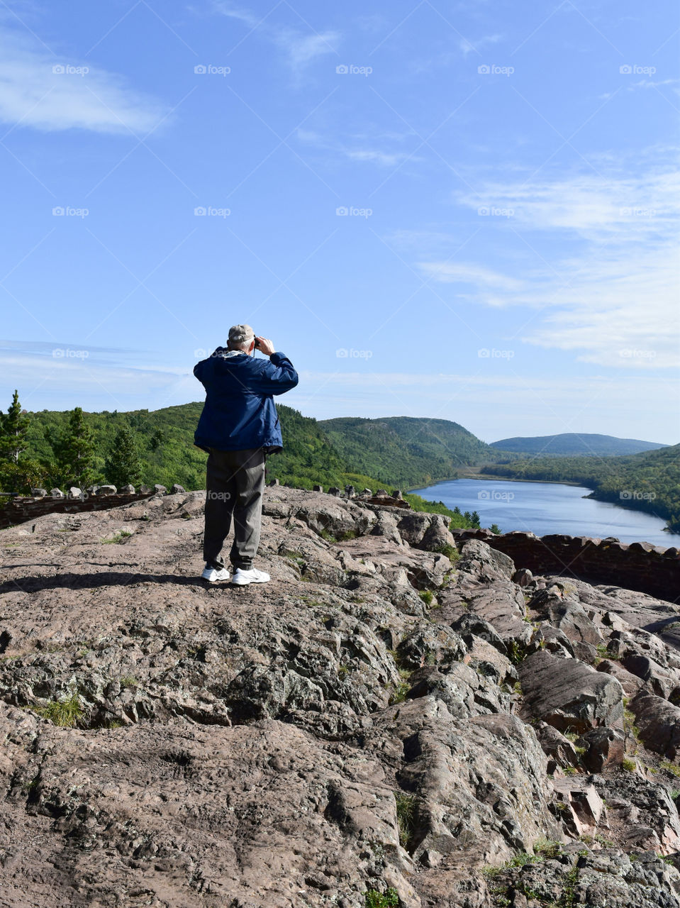 Elderly man looking at scenic  mountain view