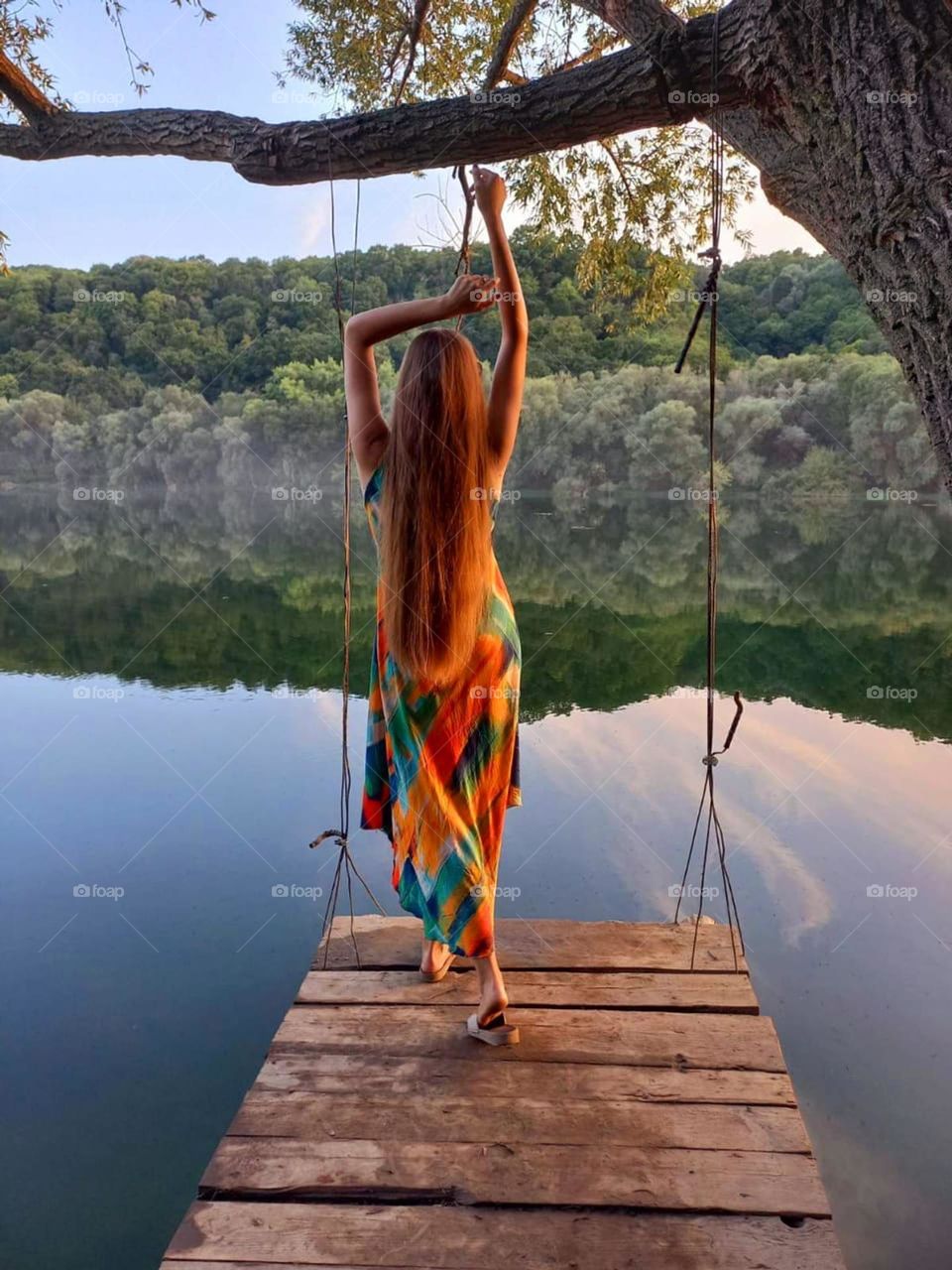 beautiful girl in nature is very happy admiring the scenery