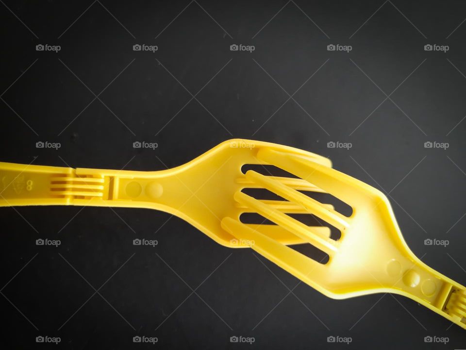 Yellow Forks on a black background