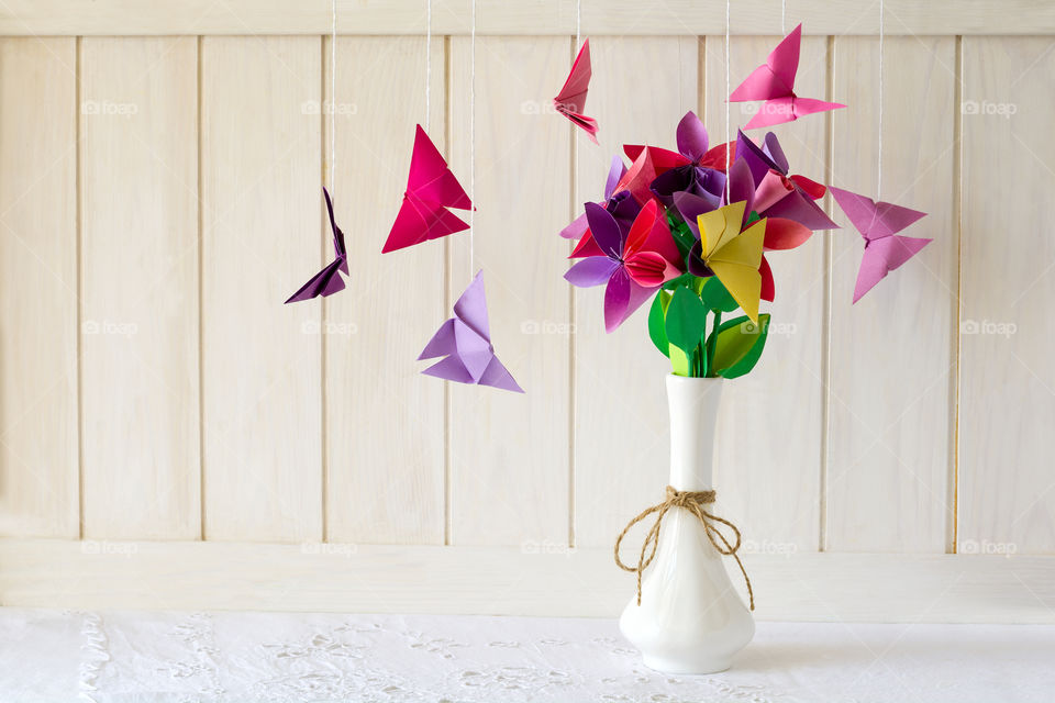 Paper craft. Colorful flowers with butterflies