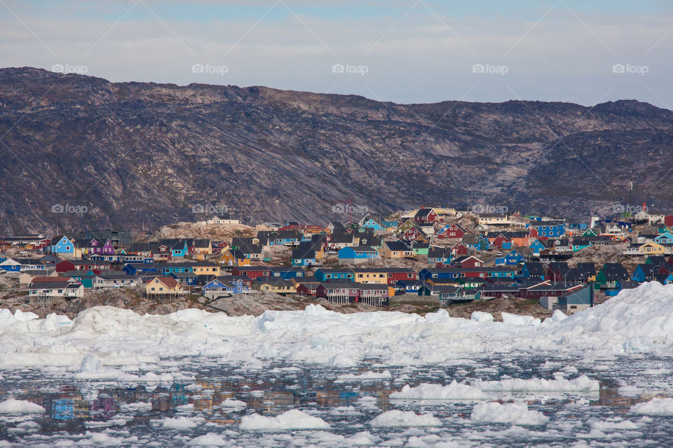 Coastal settlement and iceberg 