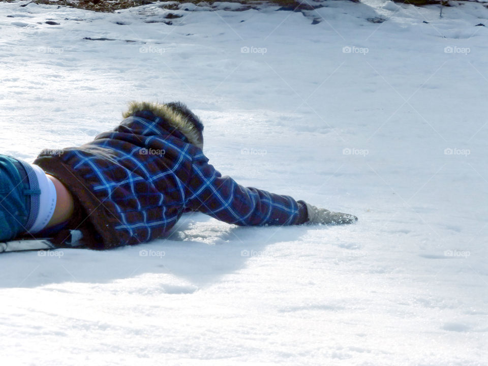 Man, boy, sliding, playing in snow