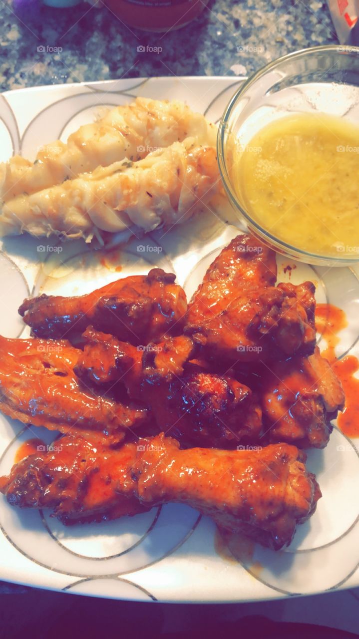 Juicy Buffalo Hot wings and wild caught Lobster tail 