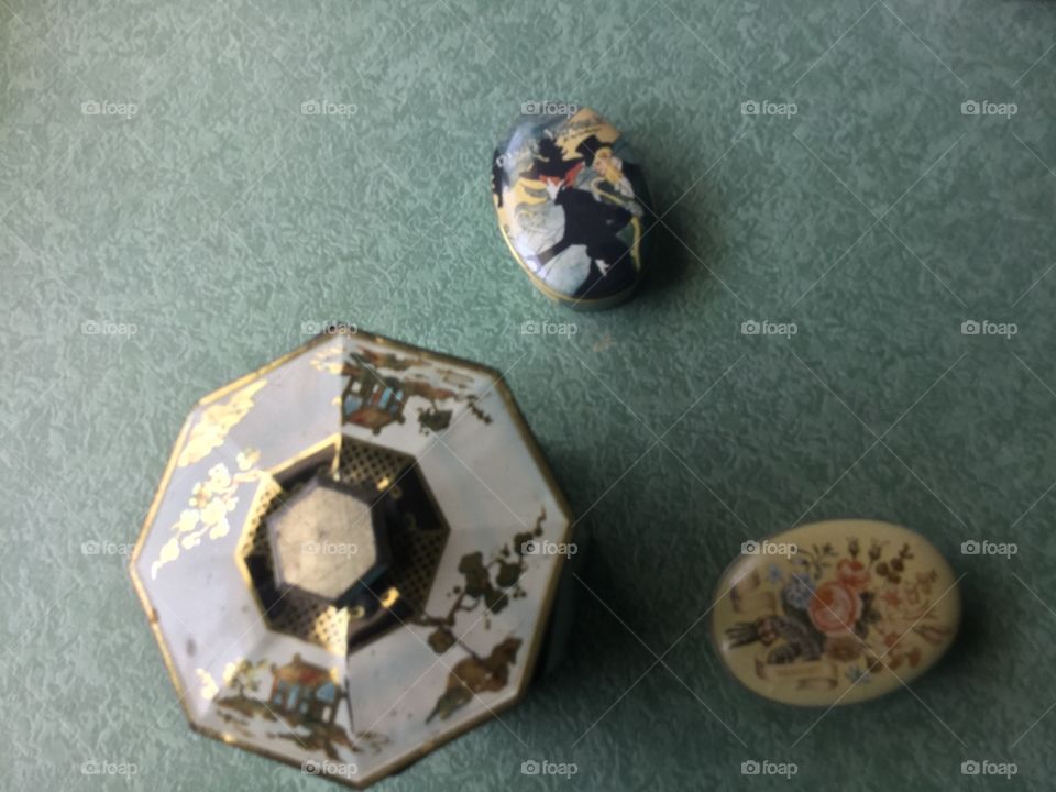 Flat lay of three antique tins
