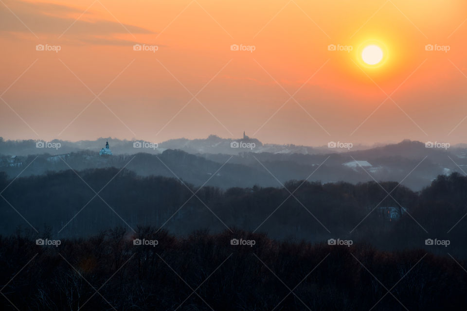 Beautiful sunset over churches on the hills in Croatia, Hrvatsko zagorje