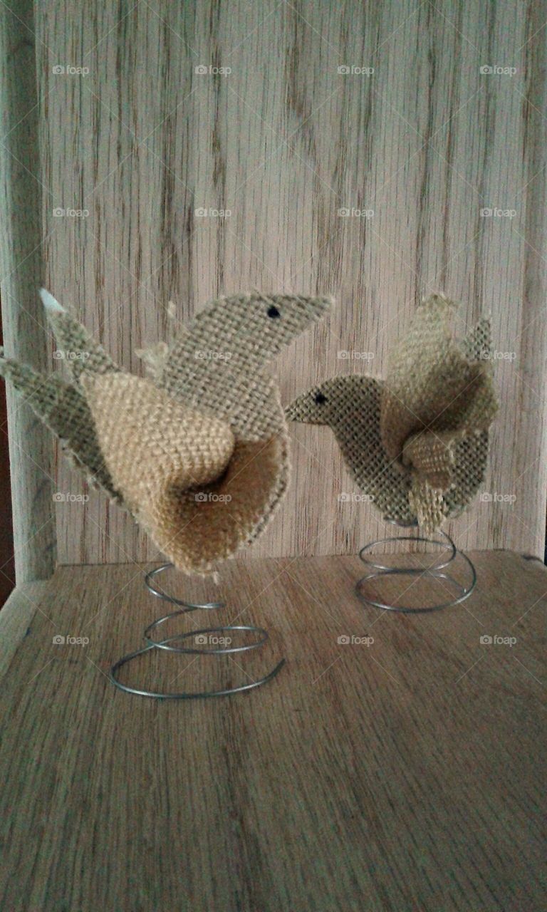 Burlap birds. Handmade for a baby shower last March. Glued to a simple wire spring.