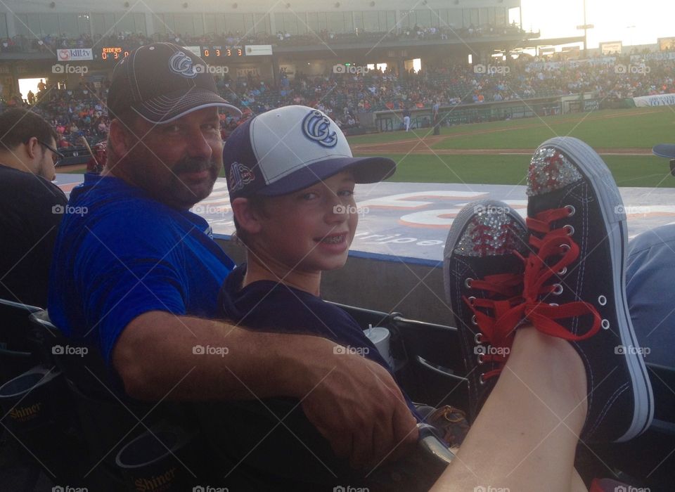 Portrait of father and son in stadium