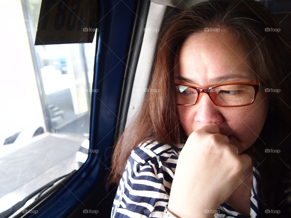 portrait of a Filipino woman with eyeglasses