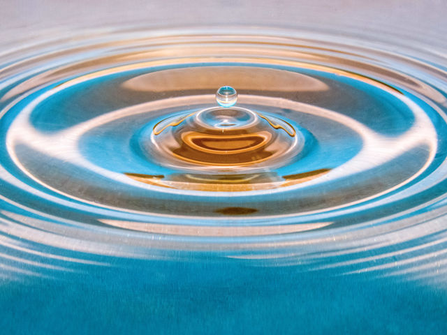 Waterdrop on a blue and orange background