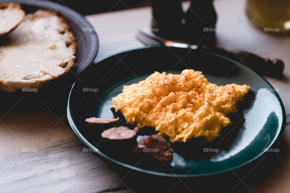 simple, traditional Polish breakfast. fresh eggs with butter, fresh bread, sausage