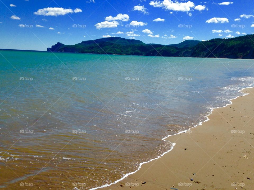 Beautiful sunny beach on the shore of the gulf St-Laurent in gaspe. 