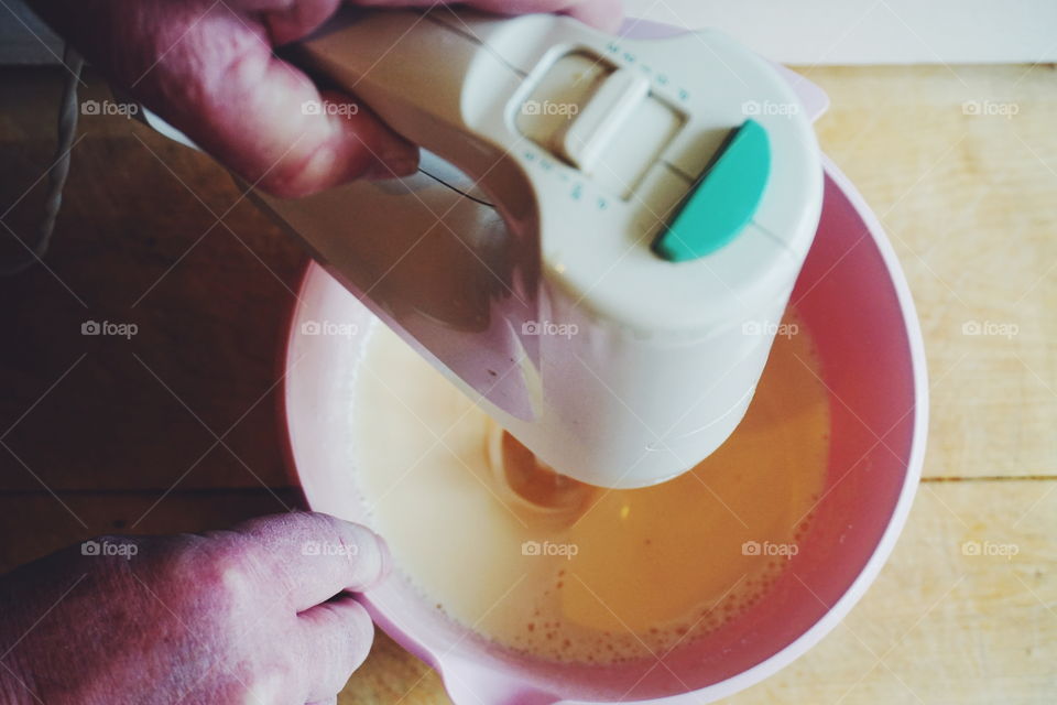 Close-up of a man preparing cake