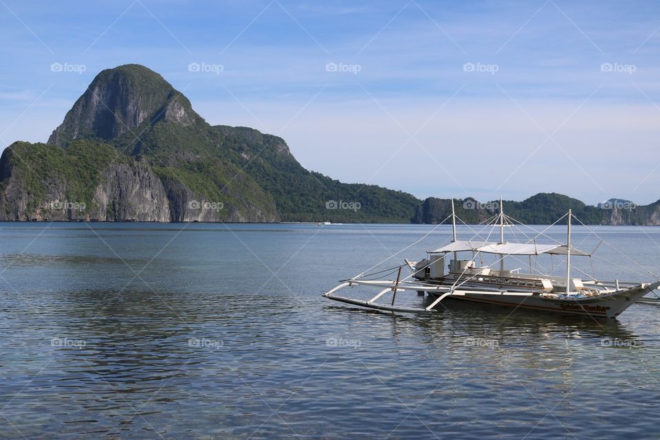 Fisherman’s boat parked in the still waters of El Nido