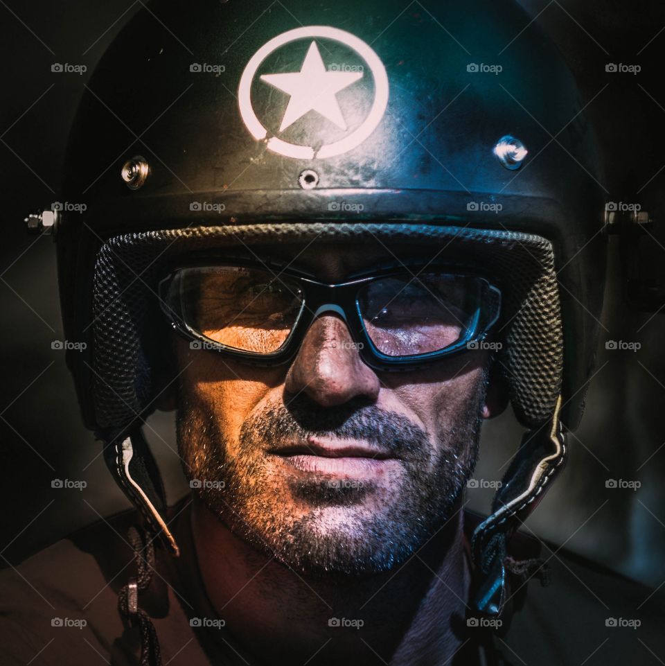 Close-up of man wearing helmet