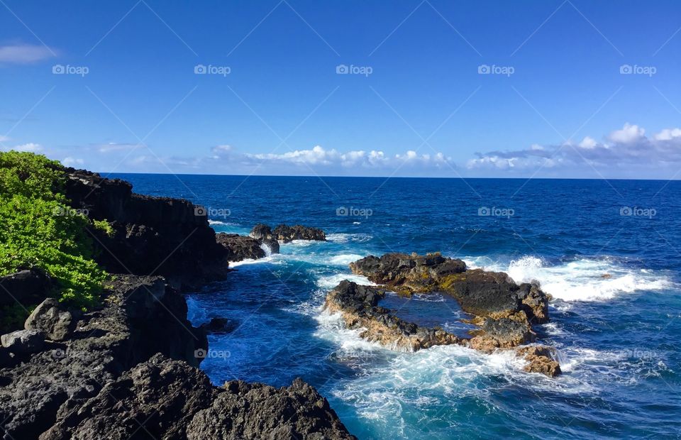 Small tidal pool on a blue sky day