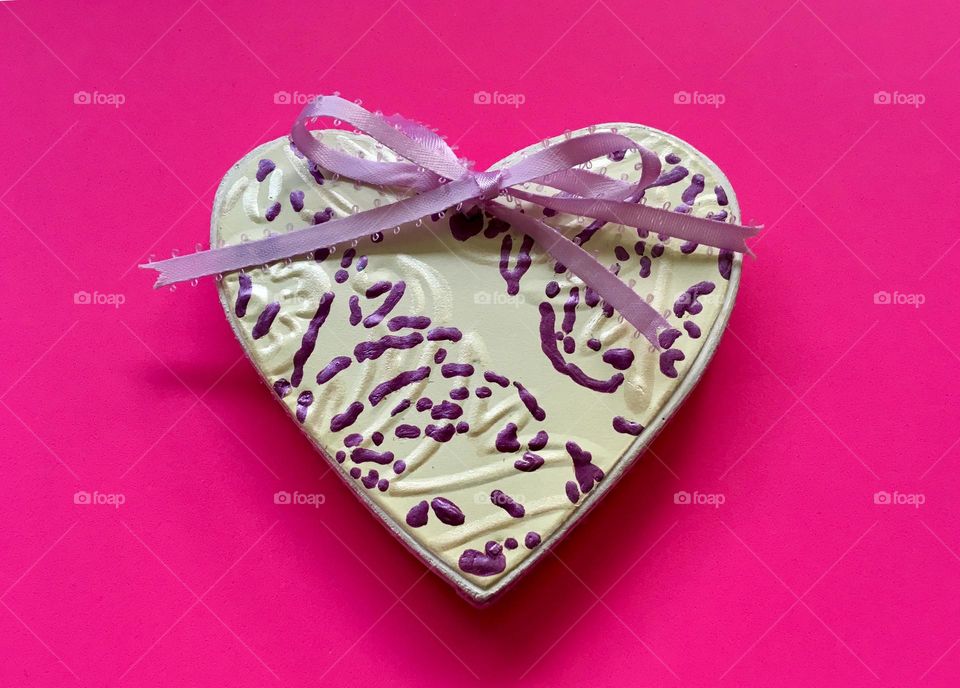 DIY and crafts; Metal and wooden heat decorated with purple paint and ribbon 