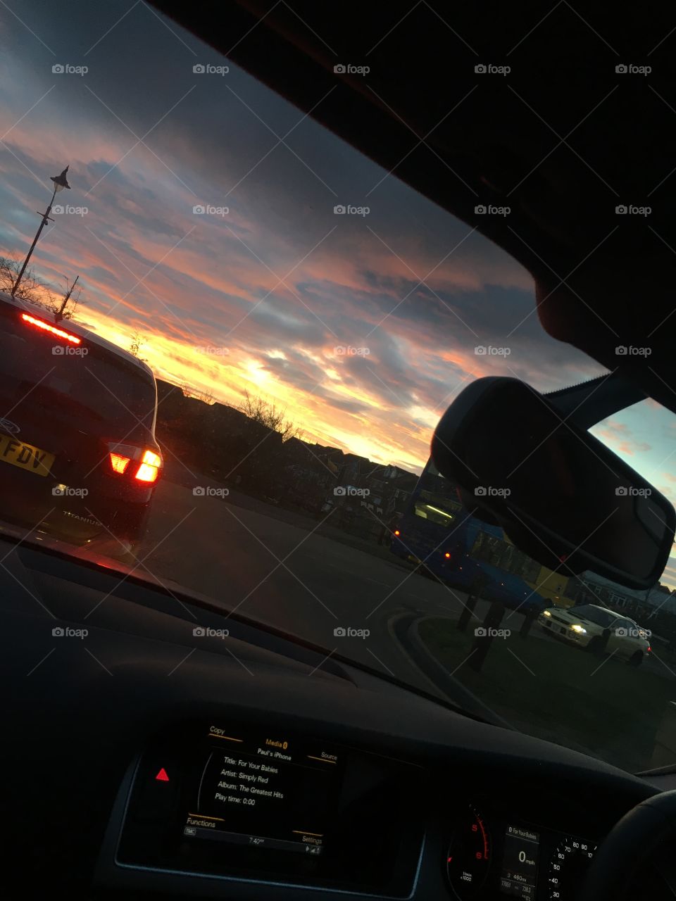 A beautiful landscape of the sunrise out of a car windscreen taken in Kent. Would look stunning in a frame or on a canvas