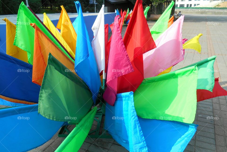 colorful flags on a street summer time