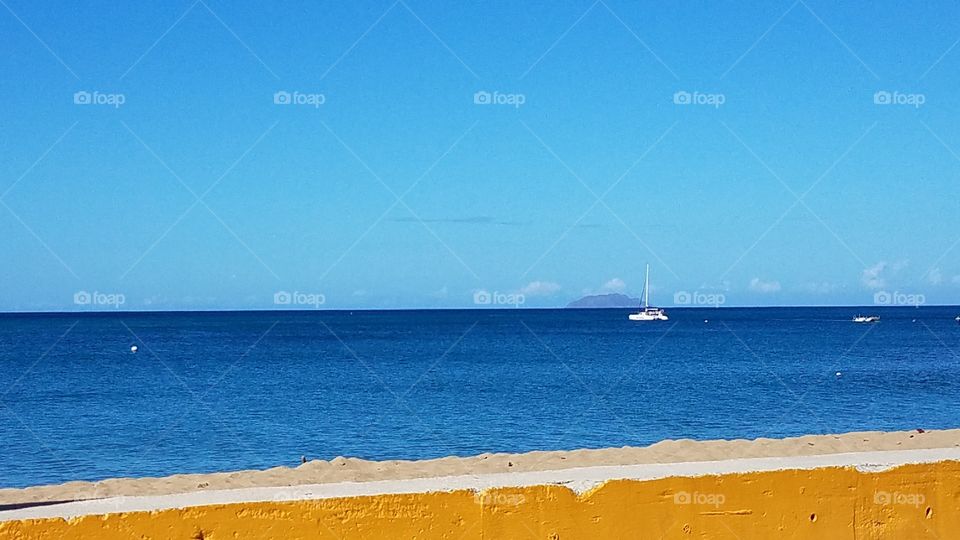 Oceanside seascape view of a mysterious Caribbean tropical island