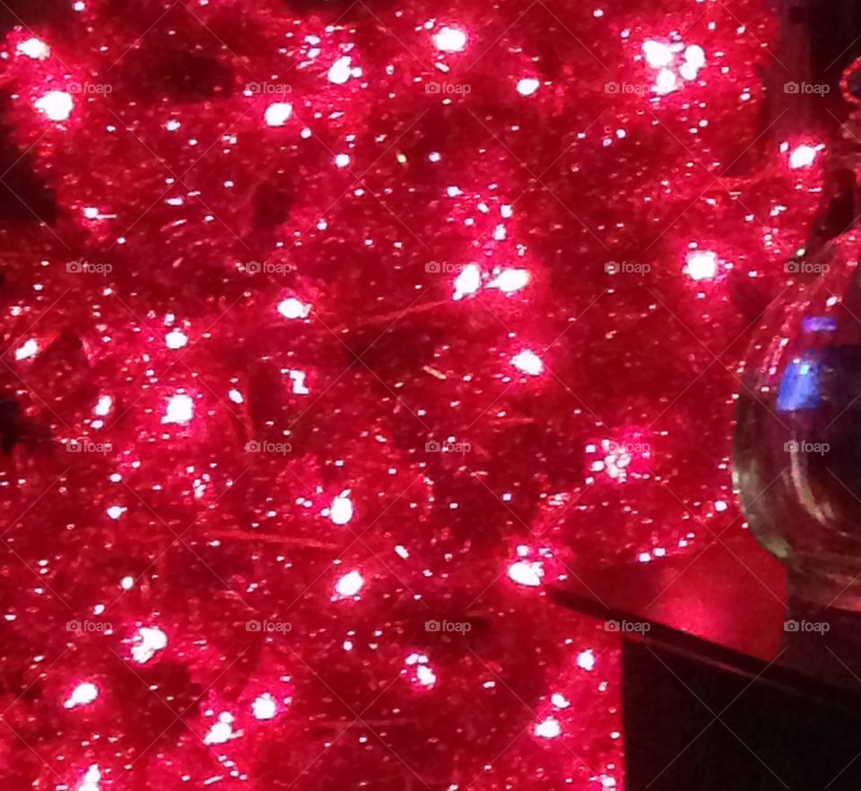 Red lights on red tinsel Christmas tree