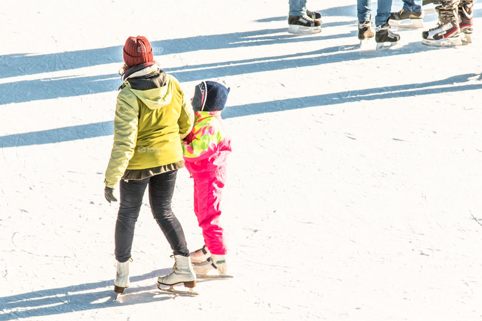 Mother And Child And Ice Skating Winter Sport
