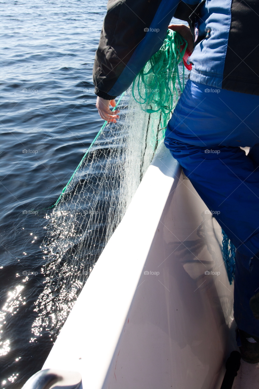 hands lake fish man by comonline