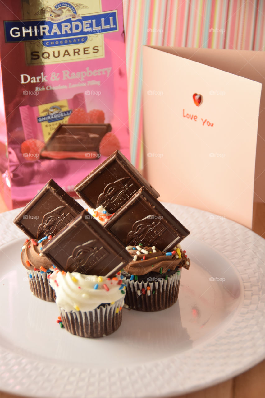 Ghirardelli chocolates and cupcakes on display