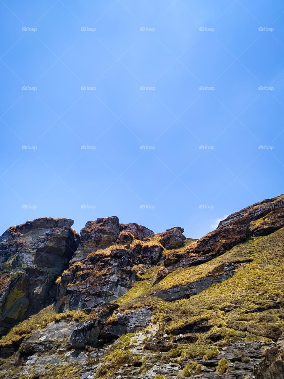 A amazing view of rock in the mountains with sky and clouds
